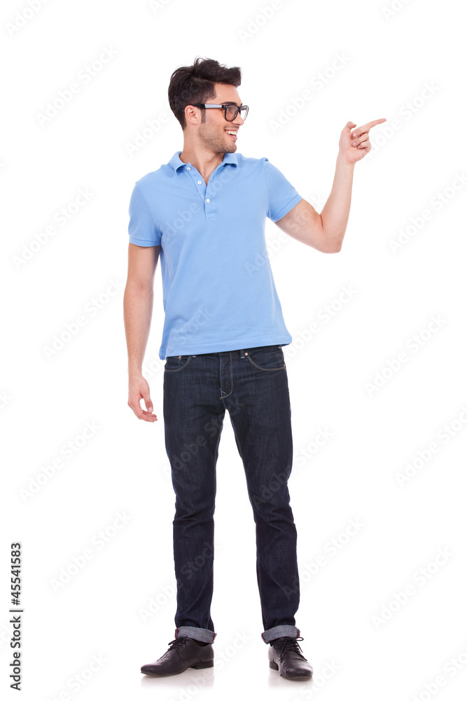 handsome man showing something to the side handsome man showing something to the side