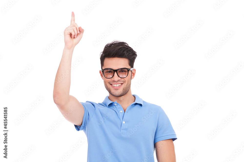young eyeglassed man pointing up young eyeglassed man pointing up