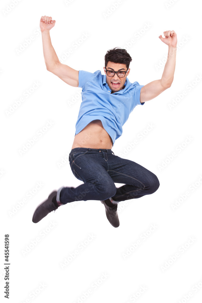 young casual man jumping and shouting