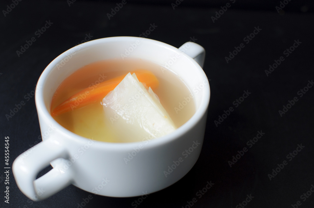 homemade vegetable soup on a black background homemade vegetable soup on a black background