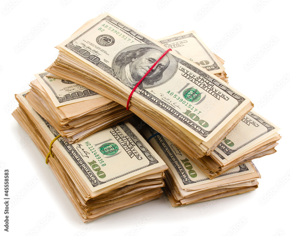 Stacks of one hundred dollars banknotes close-up isolated Stacks of one hundred dollars banknotes close-up isolated