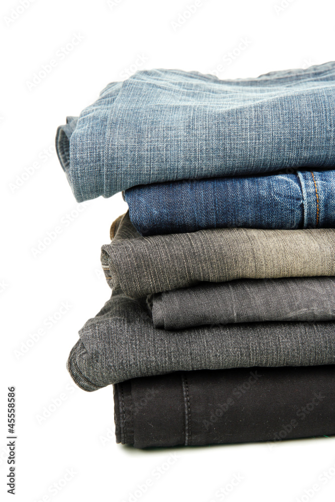 Lot of different jeans isolated on white Lot of different jeans isolated on white