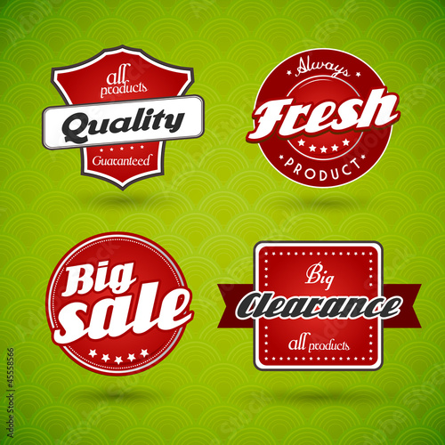 Set of red labels on green abstract background.