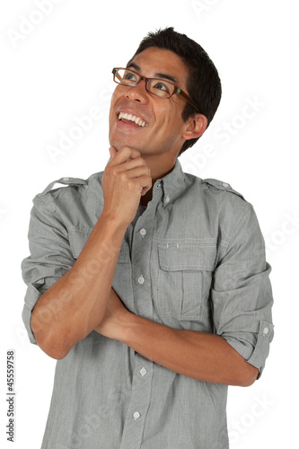 College age man looking up to the left with hand on chin