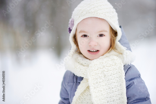Little girl having fun at winter