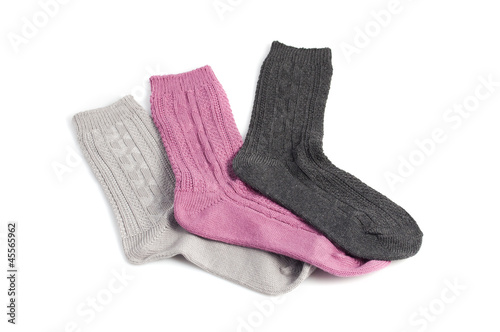 three different socks, pink, gray and black, isolated on white