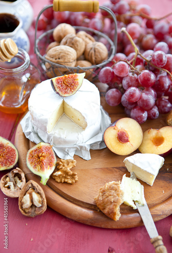 Cheese, bread and autumn fruit