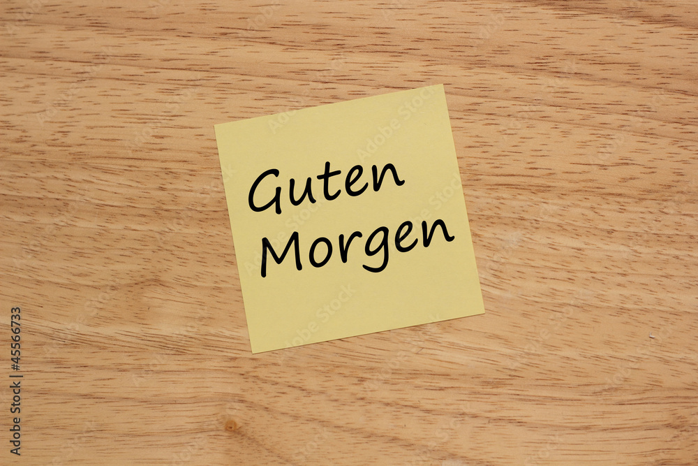 Brett mit gelben Zettel und Text Guten morgen Brett mit gelben Zettel und Text Guten morgen