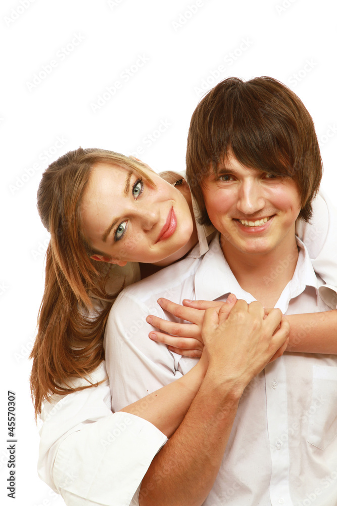 A loving young couple isolated on white background A loving young couple isolated on white background