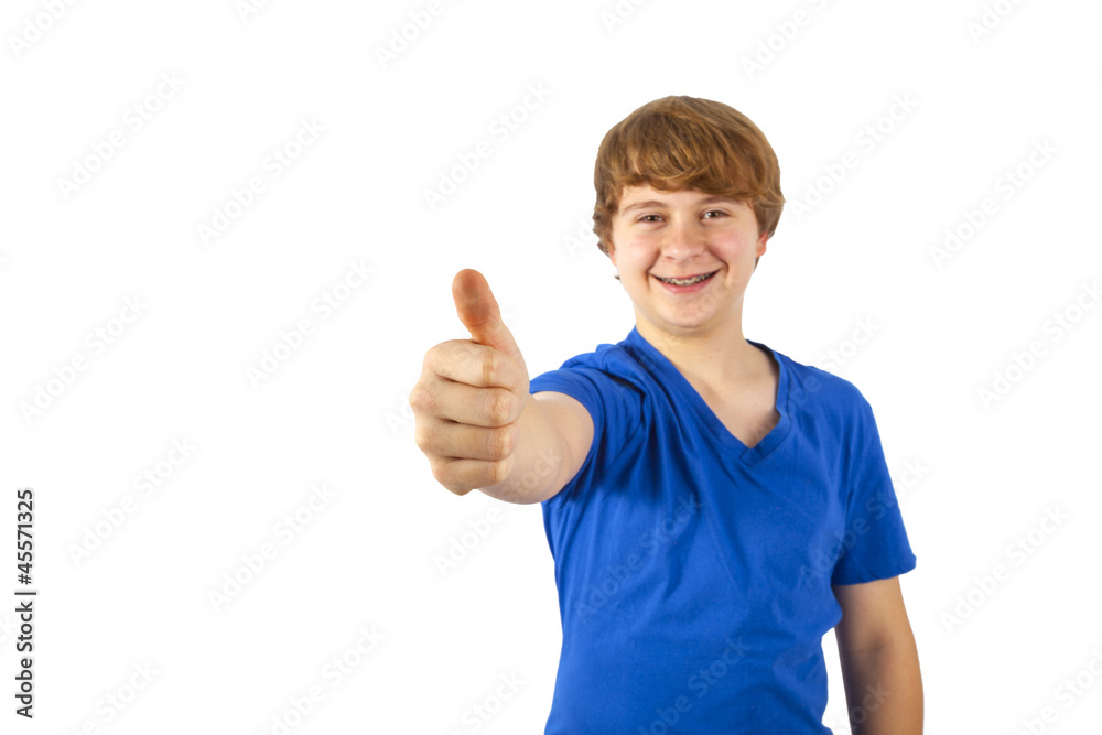 A smiling boy is showing his thumb up; isolated on the white bac A smiling boy is showing his thumb up; isolated on the white bac