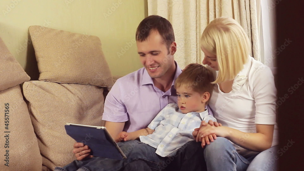 Family with a tablet pc at home Family with a tablet pc at home