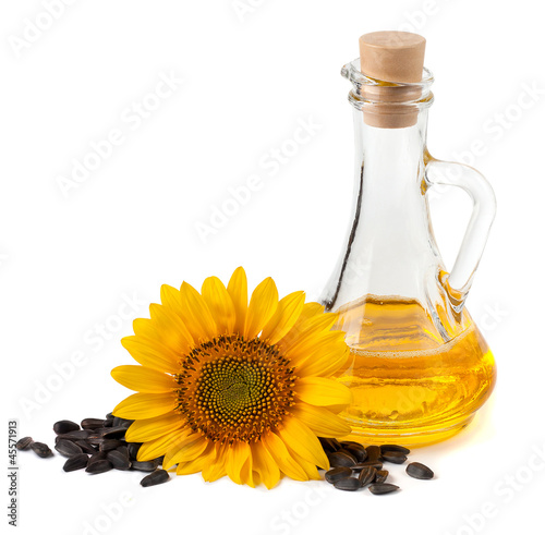 Sunflower oil with flower and seeds. On a white background