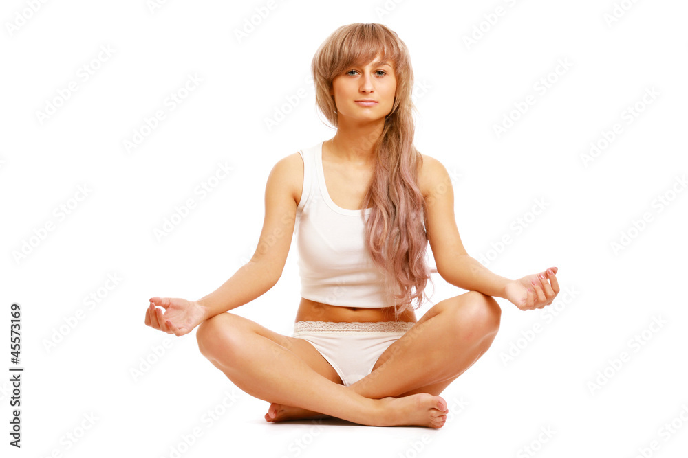 A young woman doing yoga, isolated on white A young woman doing yoga, isolated on white