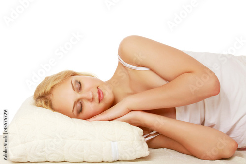 A young woman sleeping, closeup, isolated on white