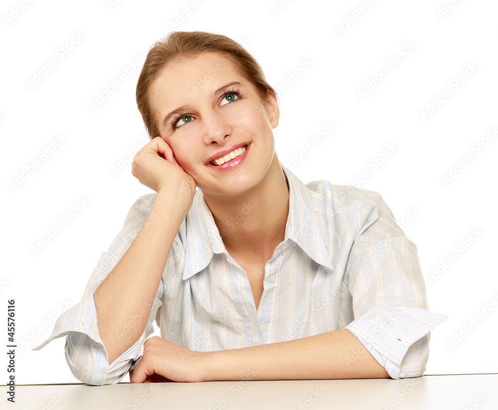 A businesswoman looking up sitting at the desk A businesswoman looking up sitting at the desk