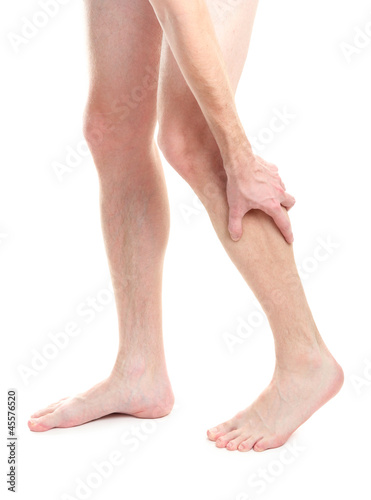 man holding sore knee, isolated on white © Africa Studio
