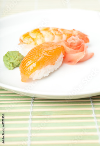 Nigiri sushi on the plate with wasabi sauce