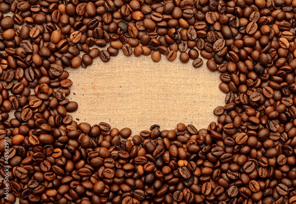 Old burlap and coffee beans background Old burlap and coffee beans background