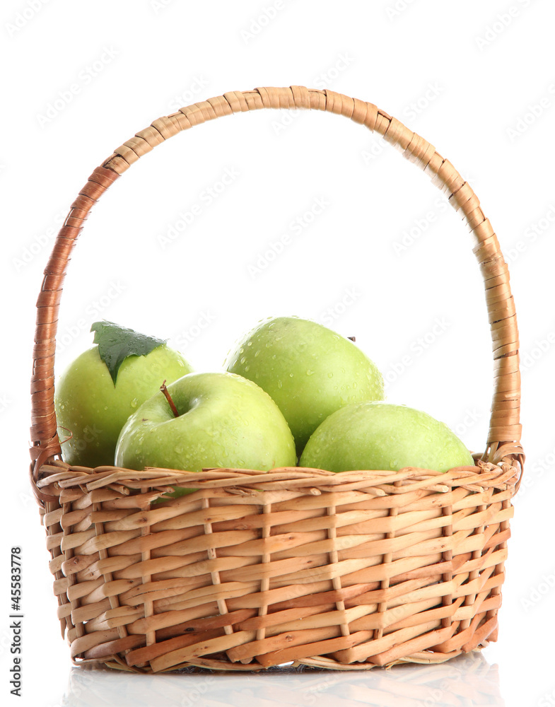 Ripe green apples with leaves in basket isolated on white Ripe green apples with leaves in basket isolated on white