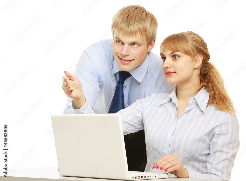 Businesspersons working at the desk with a laptop Businesspersons working at the desk with a laptop