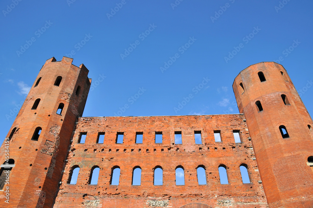 Ruins of roman Porta Palatina on blue sky