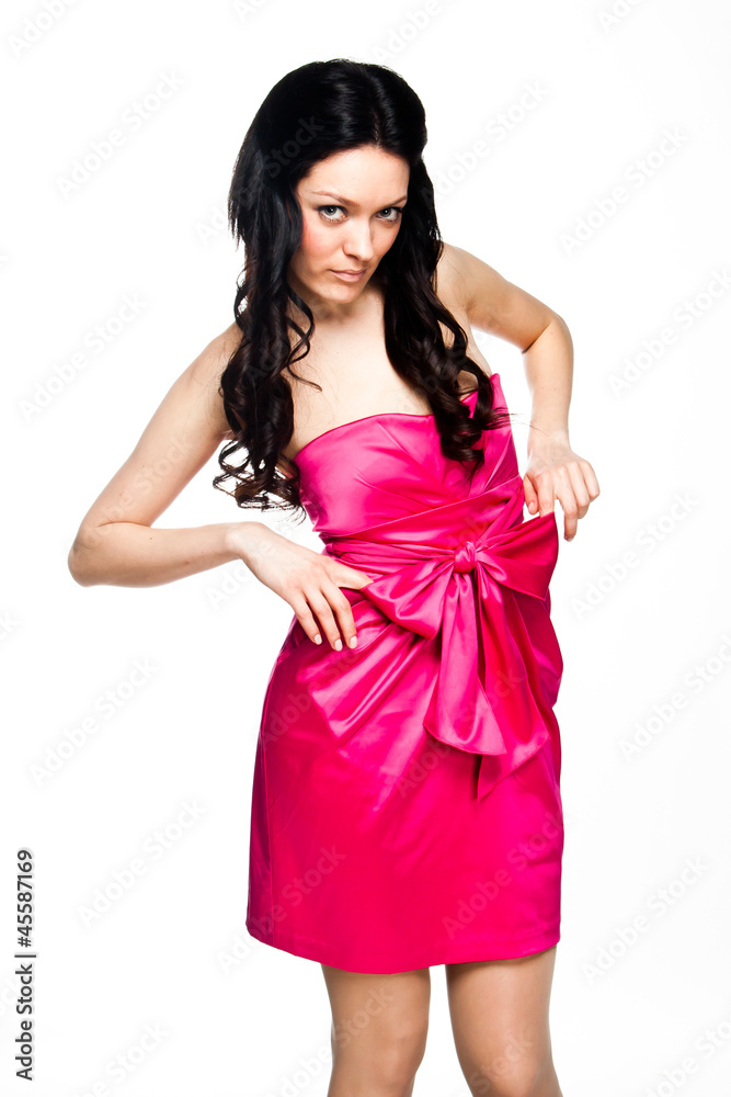 Young and beautiful woman in a red cocktail dress