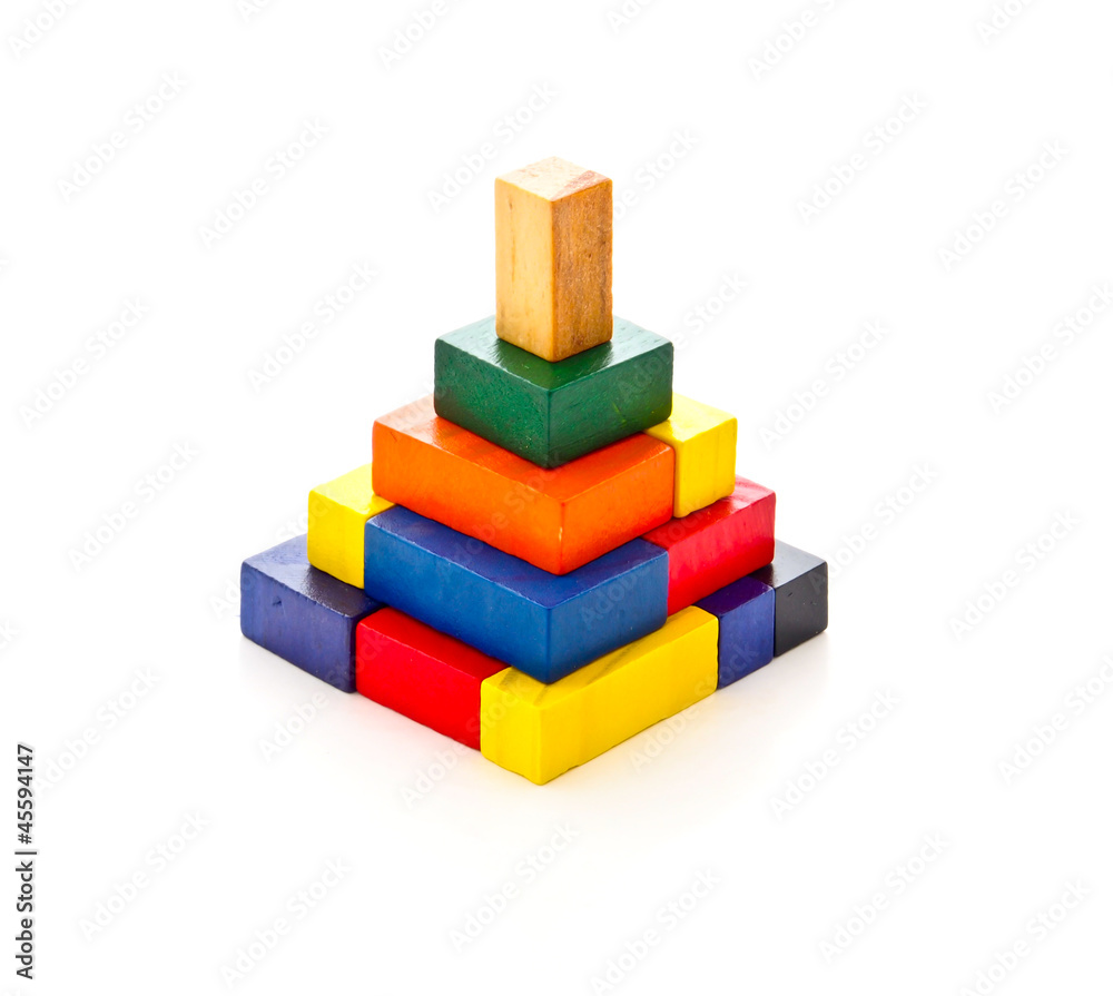 Fototapeta premium colorful puzzle arranging in pyramid shape on white background