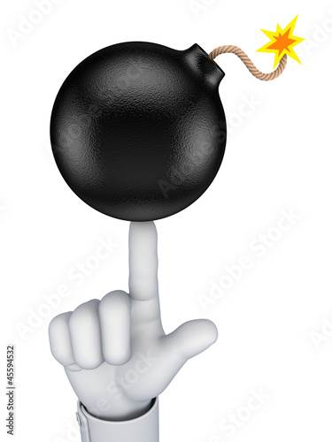 Black bomb ballanced on a finger. photo