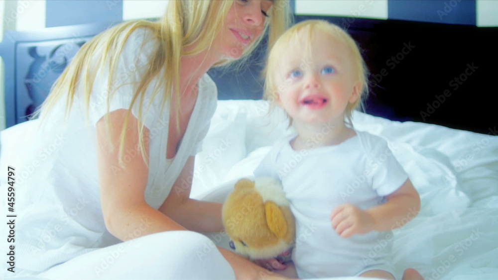 Blonde Mom Bouncing Young Child Bedroom Blonde Mom Bouncing Young Child Bedroom