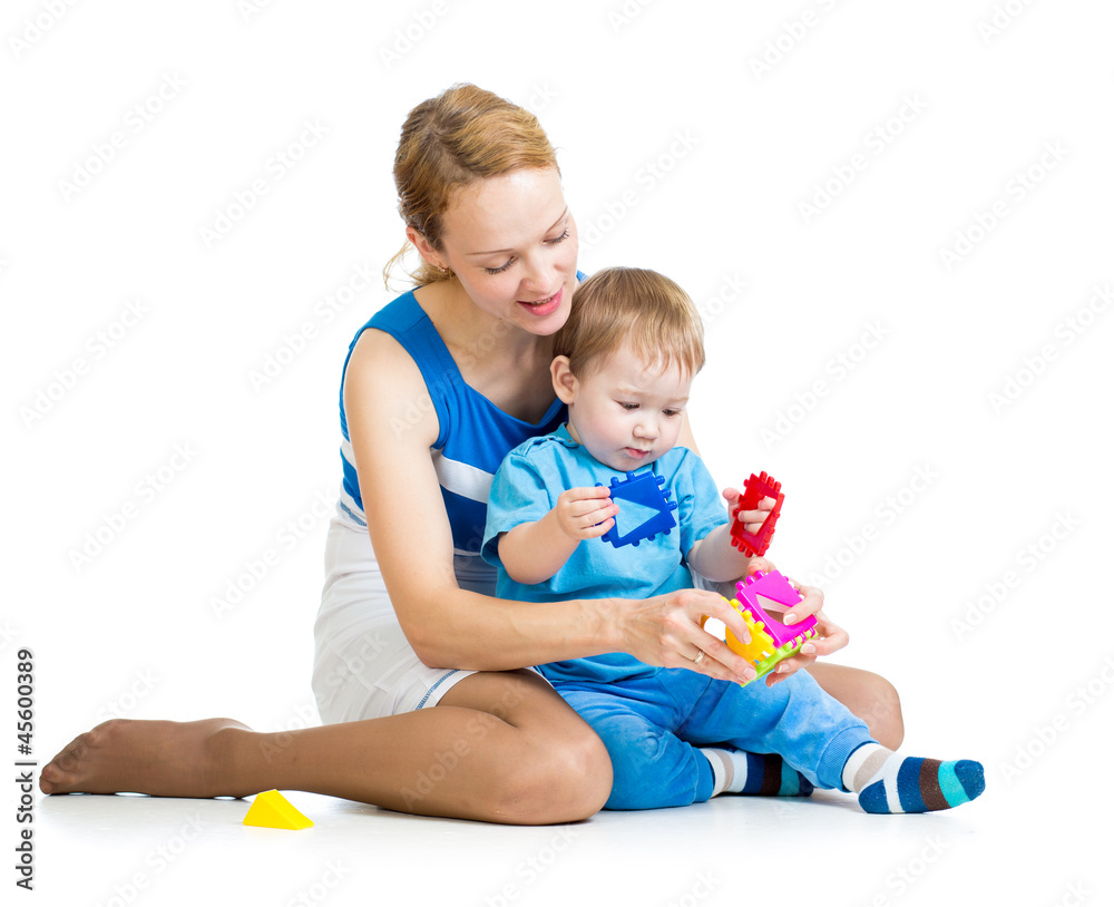 baby boy and mother playing together with puzzle toy baby boy and mother playing together with puzzle toy