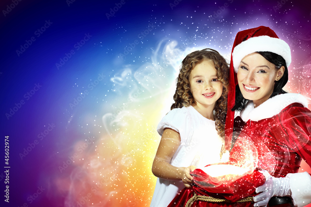 Little girl with christmas gifts and santa Little girl with christmas gifts and santa