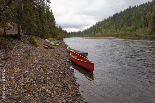 Tents and canoes at McQuesten River Yukon Canada
