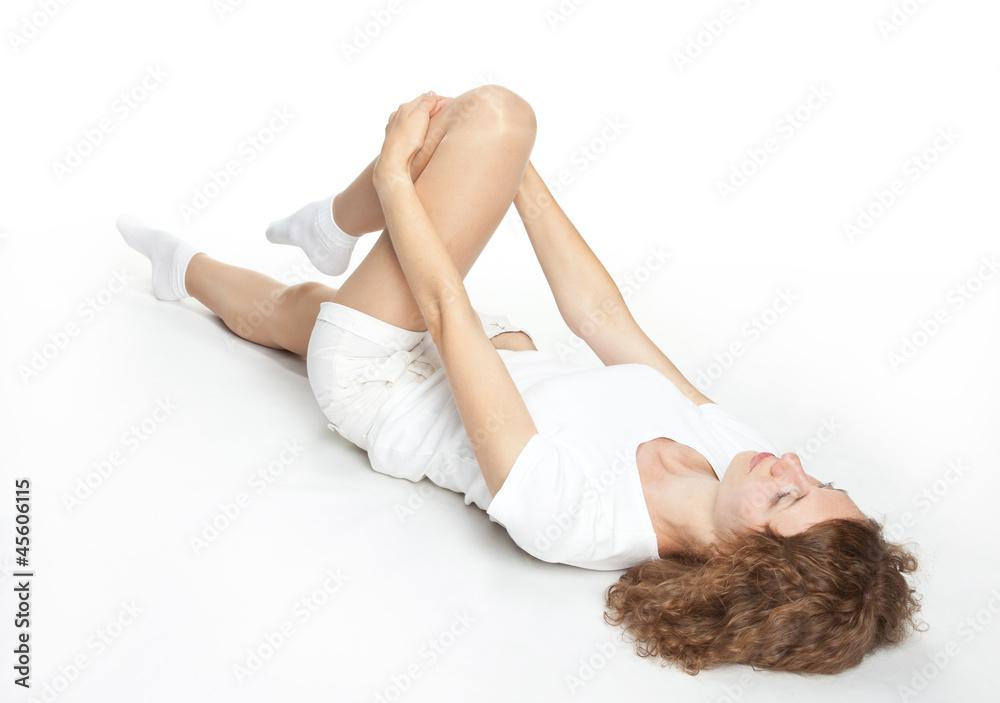 Naklejka premium Sporty young woman training on the floor