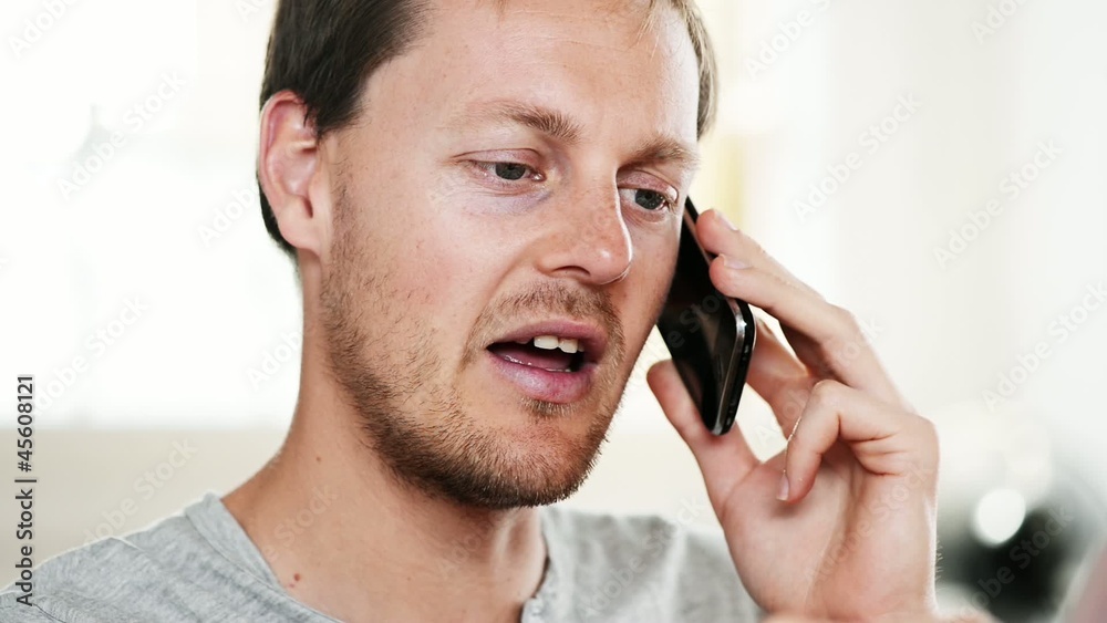 Happy young man talking on mobile phone Happy young man talking on mobile phone