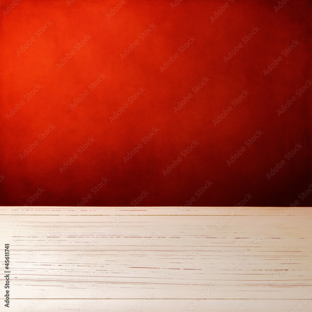 Background with white wooden table and grunge red wall