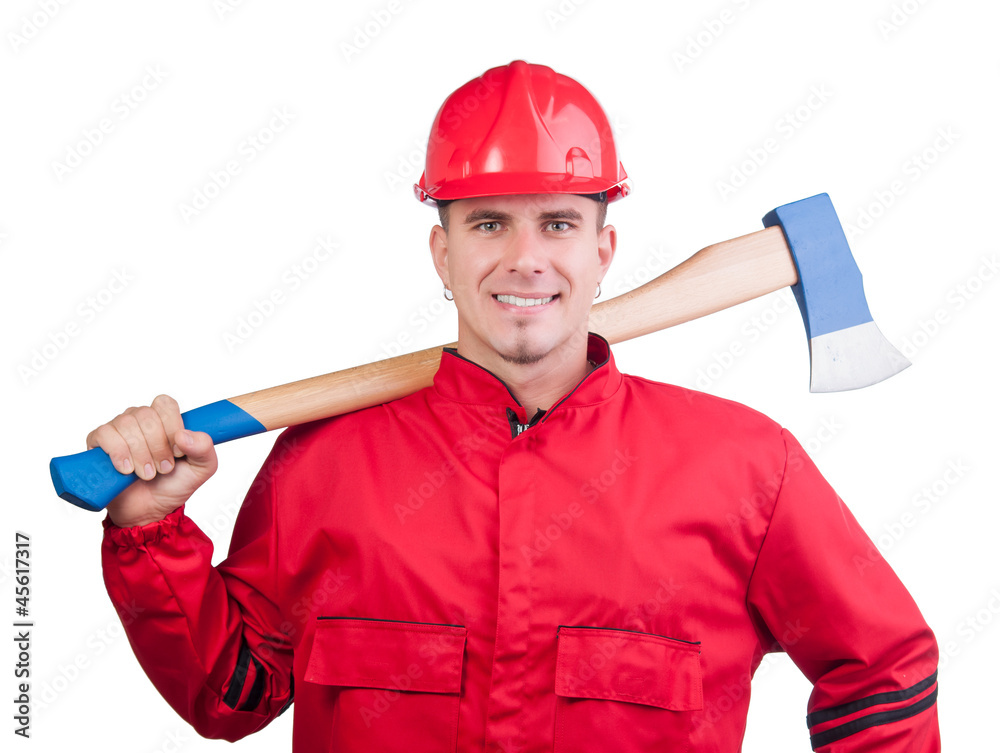 Young smiling fireman with hard hat, uniform holding ax Young smiling fireman with hard hat, uniform holding ax