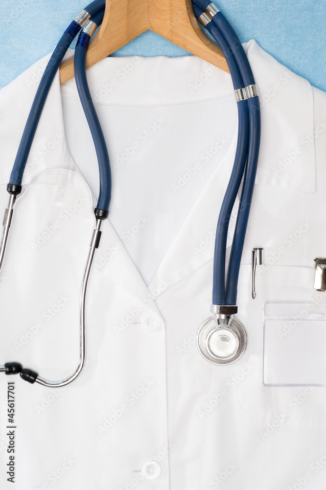 Medical lab coat hanging on hanger stethoscope Medical lab coat hanging on hanger stethoscope