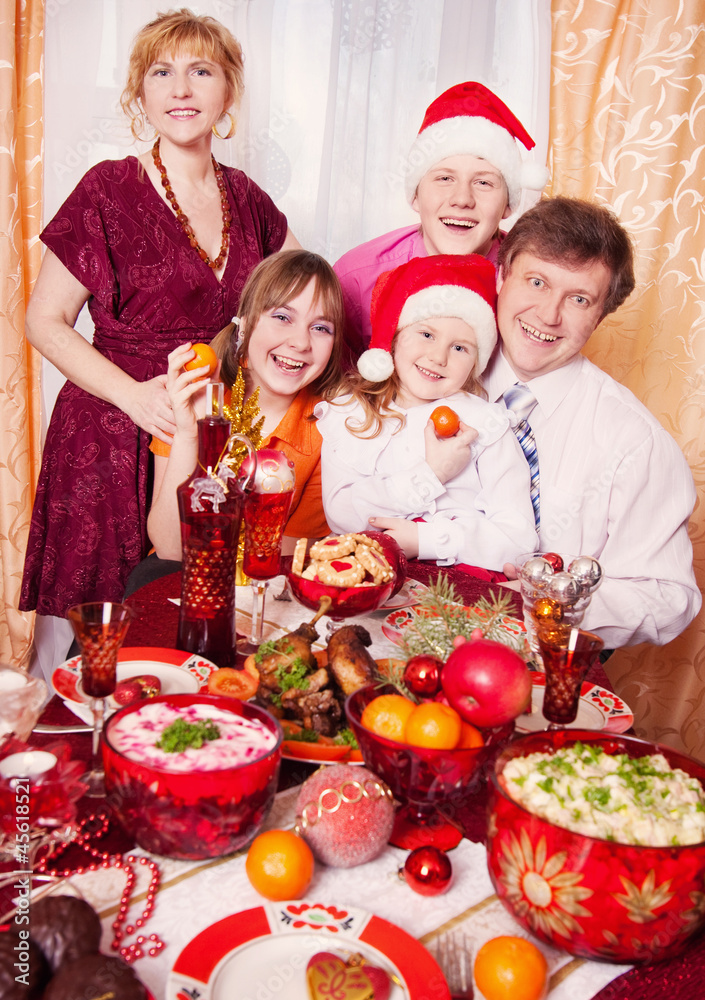 Family Enjoying Christmas Meal At Home Family Enjoying Christmas Meal At Home