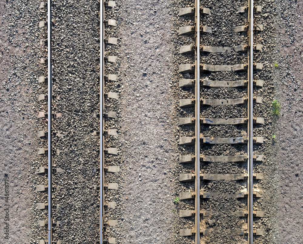 Fototapeta premium Background texture of railway tracks on gravel