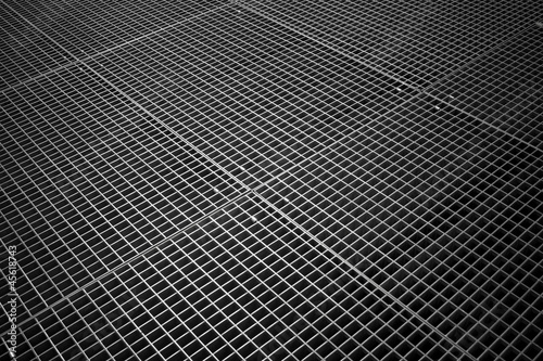 Background texture of tiled metal ground grid