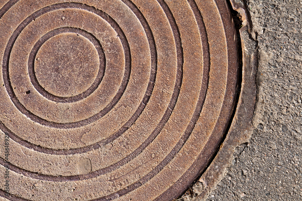 Old rusted sewer manhole