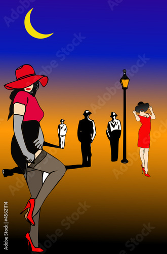 Alcune donne si prostituiscono in una strada di notte
