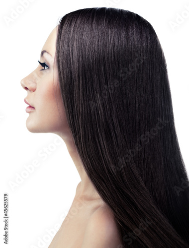 Isolated portrait of a young brunette in a profile