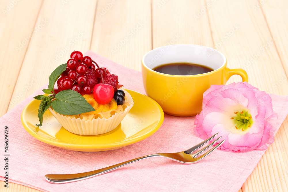 Dulcet cake with fruit and berries on wooden table Dulcet cake with fruit and berries on wooden table