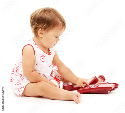 Cute baby with telephone is...