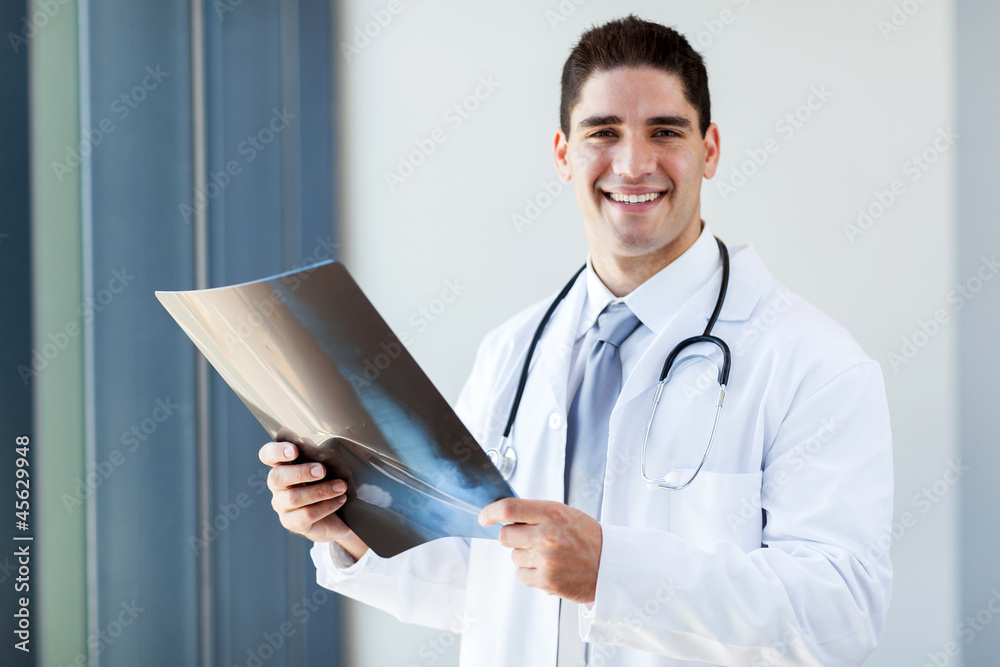 happy male medical doctor with x-ray film happy male medical doctor with x-ray film