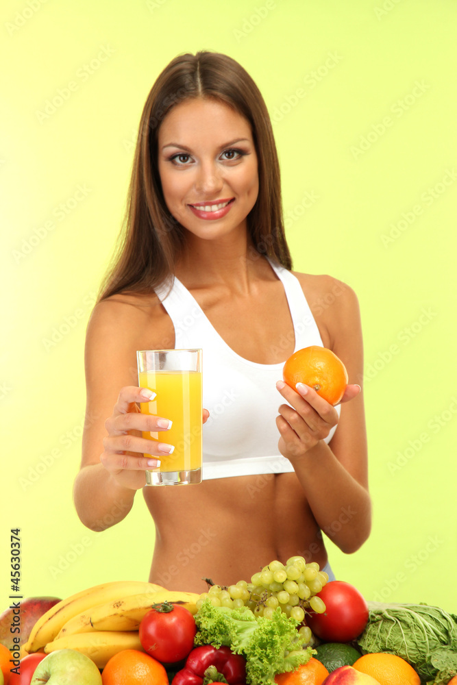 beautiful young woman with fruits and vegetables and glass of beautiful young woman with fruits and vegetables and glass of