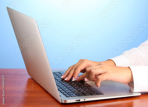 business woman's hands typing