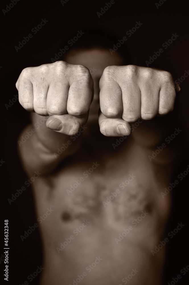 Two human fists as a symbol of aggression.