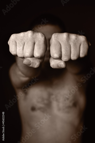 Obraz na płótnie Two human fists as a symbol of aggression. w salonie